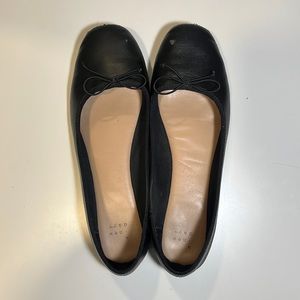 Worn black dress shoes
